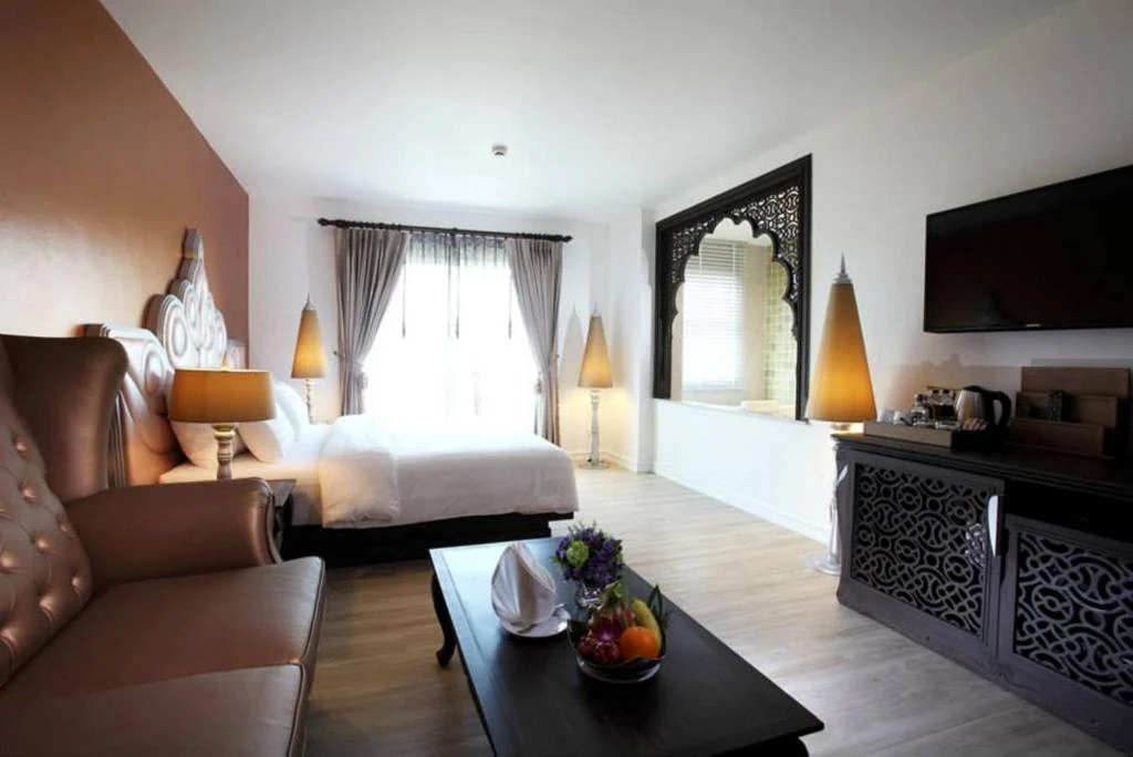 Premier room with lounge seating at Chillax Resort Bangkok